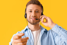 Handsome Consultant Of Call Center In Headset On Yellow Background