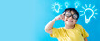 © MIA Studio - Smart kid nerd asian boy child with light bulb have good idea.Happy student kid thinking creative on blue banner background.Brainstorming and idea concept.online learning imagination innovation.stem.
