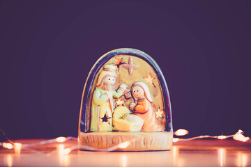 Canvas Print - Christmas nativity scene of born child baby Jesus Christ in the manger with Joseph and Mary.Traditional Christmas advent Nativity Scene Jesus in the manger on bokeh background.christian nativity scene