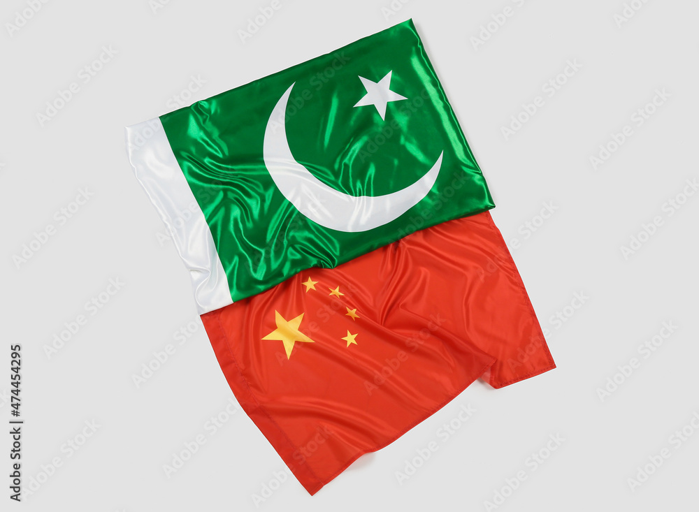 Flags of China and Pakistan on light background