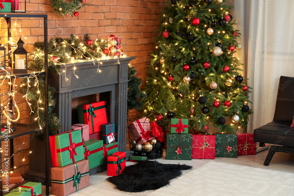 Interior of modern living room with Christmas tree and fireplace