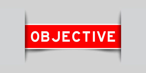 Sticker - Inserted red color label sticker with word objective on gray background