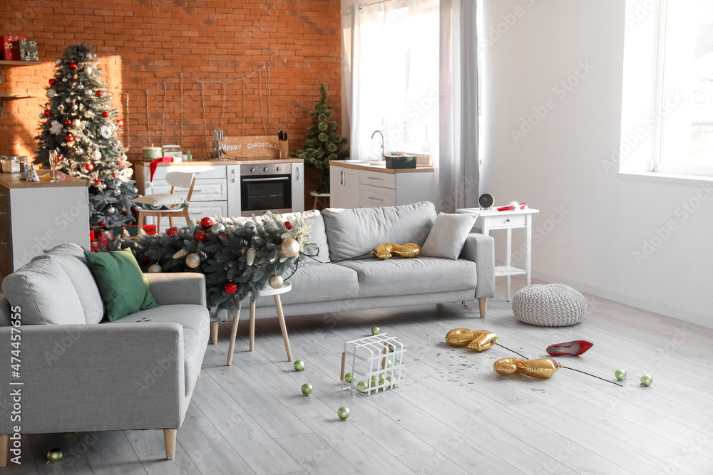 Interior of messy room after Christmas party