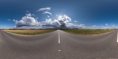 Wall Mural - full seamless spherical hdri 360 panorama on old no traffic asphalt road among fields before storm in equirectangular projection, ready for VR AR virtual reality