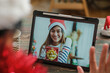 © weedezign - Christmas and new year  video call with friend with tablet together at home
