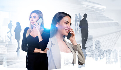 Canvas Print - Two businesswomen wearing formal wear are talking on smartphones