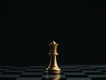 Close Up The Golden Queen Chess Piece Standing Alone On A Chessboard On Dark Background. Leader, Influencer, Lonely, Commander, Strong, And Business Strategy Concept.