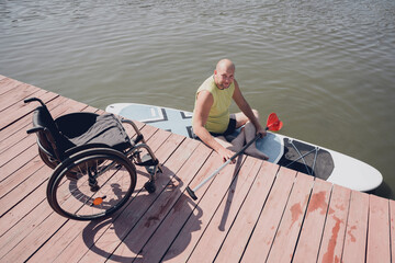 Person with a physical disability ride on sup board