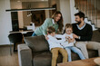 © BGStock72 - Siblings fighting over TV remote control at home