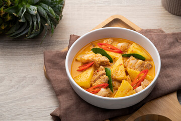 Wall Mural - Thai Red curry Pineapple with Sliced Pork Belly in white bowl