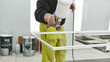 © Friends Stock - Bringing innovation to the surface. Man is holding airbrush spray vaporizer for painting and dyeing