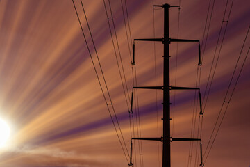 Electricity pylon against the sky. High - voltage power lines .