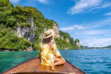 Wall Mural - Koh Phi Phi Thailand, Asian woman in longtail boat exploring the Phi Phi Lagoon around the Island. 