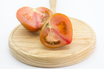 Wall Mural - half a split tomato raf on a wooden board