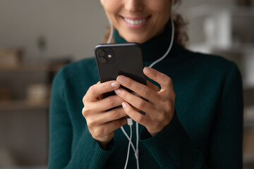 Poster - Crop close up of smiling Latino woman use cellphone talk speak on video call online on device. Happy Hispanic female have webcam digital virtual communication on smartphone. Technology concept.