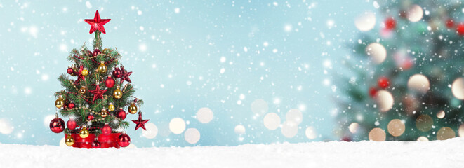 Wall Mural - christmas tree with decoration on a winter background.