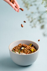 Sticker - Healthy breakfast. Oat granola with fresh blueberries, almond and yogurt in bowl