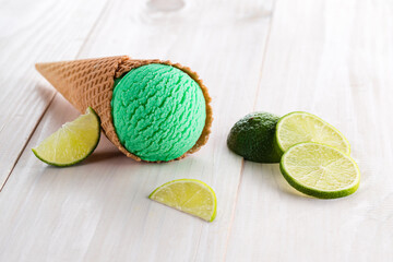 Canvas Print - Scoops of fresh green lime icecream in a cone