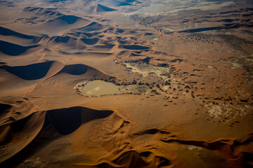  Aerial view of Namib Desert dunes, Namibia.
Visible water in Sossusvlei.