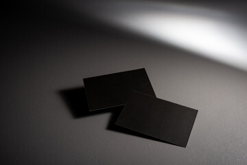  two Black mock up business card for branding on grey rustic background .