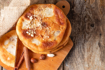 Wall Mural - Sweet dessert from south korea hottok. View from above. Wooden table. Free space.