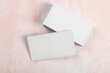 © Nana_studio - Blank business cards. Mock up on pink marble background. Copy space for text.