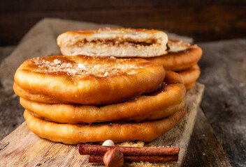 Wall Mural - Korean street food hotteok. Fried dough stuffed with nuts and sugar.