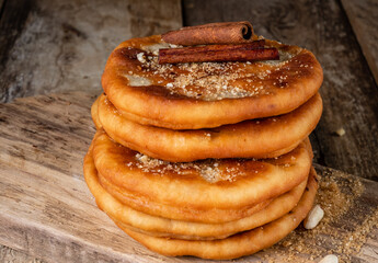 Wall Mural - Korean street food hotteok. Fried dough with different fillings. Close-up.