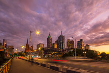 Australia, Melbourne, Victoria, Cloudy Sky Over Saint Kilda Road At Dusk