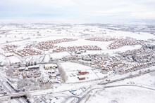 UK, England, Lichfield, Aerial View Of Snow-covered Suburb