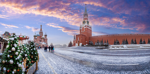 Wall Mural - Moscow Christmas. Panorama Russia. Red Square on winter day. Christmas trees near Kremlin. St. Basil's Cathedral in snow. Winter Moscow with blue sky. New Year's tourism Moscow. Weekend in Russia