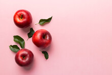 Many Red Apples On Colored Background, Top View. Autumn Pattern With Fresh Apple Above View With Copy Space For Design Or Text