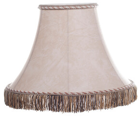 Wall Mural - classic cut corner bell shaped beige tapered lamp shade with a brown fringe on a white background isolated close up shot