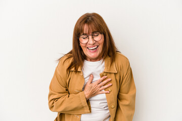 Wall Mural - Middle age caucasian woman isolated on white background laughs out loudly keeping hand on chest.