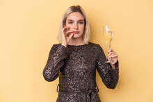 Young Caucasian Woman Celebrating New Year Isolated On Yellow Background With Fingers On Lips Keeping A Secret.