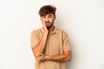 Wall Mural - Young mixed race man isolated on grey background who is bored, fatigued and need a relax day.