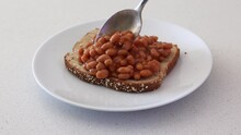 Serving Baked Beans On Toast