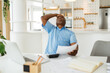 © Astarot - A nervous African pensioner holding his head and in the other hand, he is having bills. He spent too much this month.