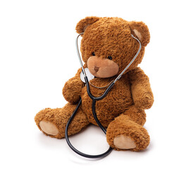Wall Mural - medicine, healthcare and childhood concept - teddy bear toy with stethoscope on white background