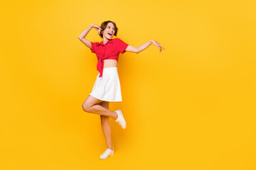 Poster - full body photo of crazy excited person look empty space have good mood isolated on yellow color bac