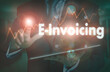 © Duncan Andison - A businessman operating a computer display with a E-Invoicing business word concept on it.