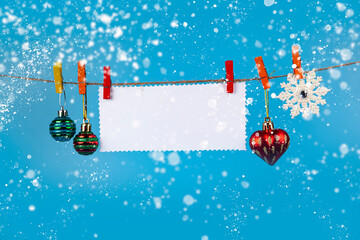 Wall Mural - Christmas decorations hang on a rope. Christmas card.