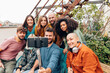 © Carlo - group of young making a group selfie - end of holiday or end of course photos - generation z lifestyle