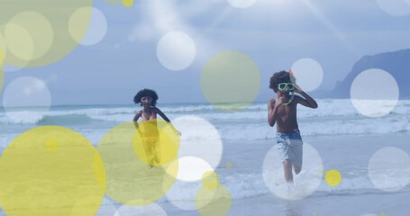 Poster - Animation of african american brother and sister playing at beach over light spots