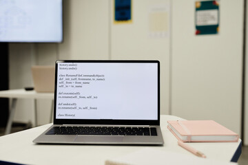 Background image of code on laptop screen in programming class for children, copy space