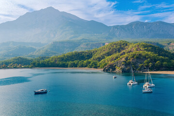 Wall Mural - sea bay among the mountains with some yachts, view of the South Harbor of the ancient city of Phaselis, Turkey