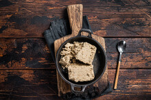 Halva With Sunflower Seeds And Honey In Pan. Wooden Background. Top View