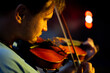 © Hennadii - A man plays the violin on the stage of close