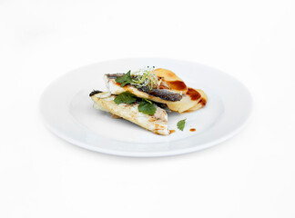 Grilled fish dish on white background