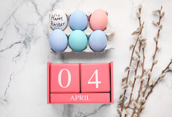 Wall Mural - Calendar with date of April 4, painted eggs and willow branches on light background